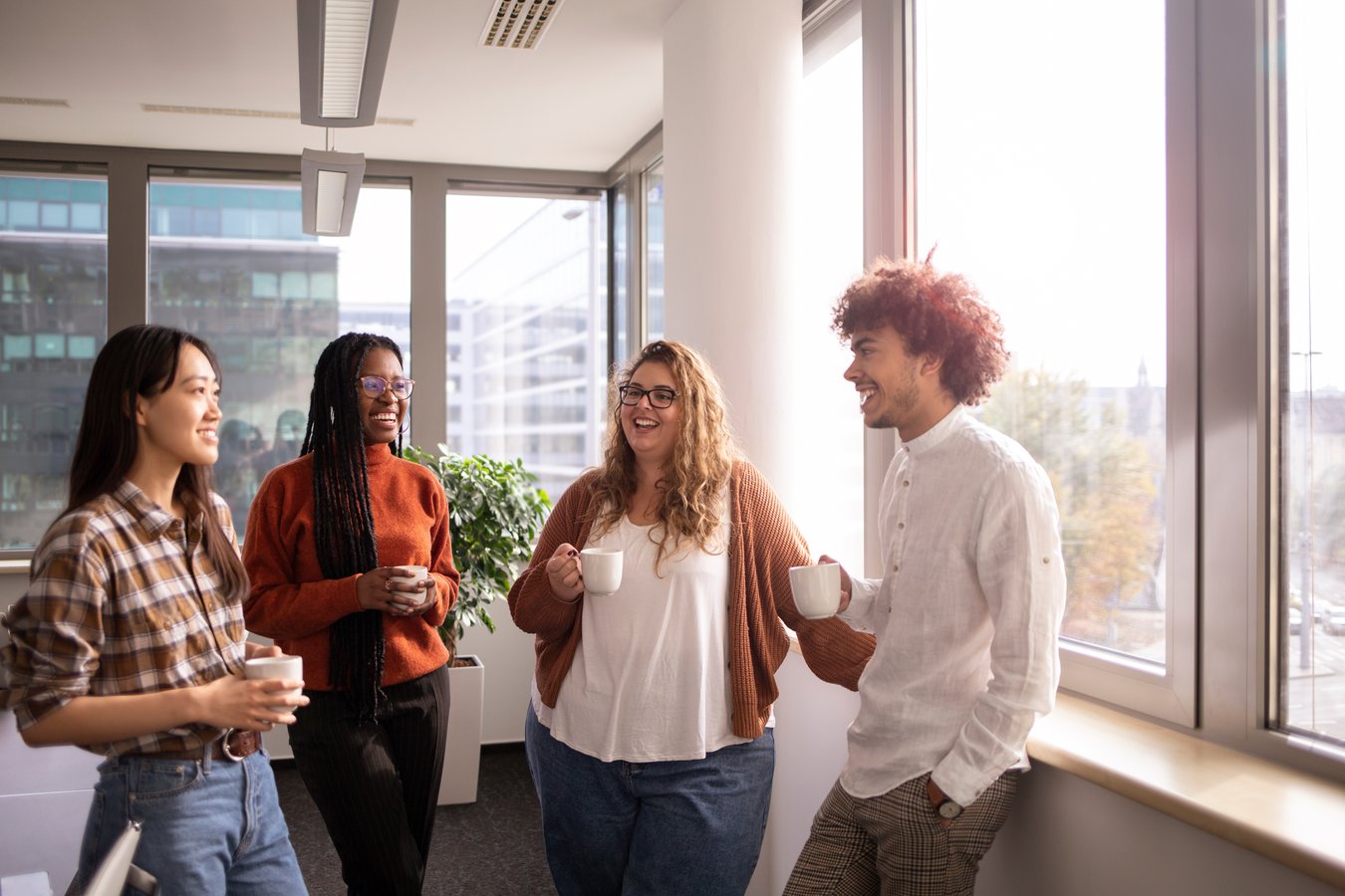 Young office workers drinking coffee on their break