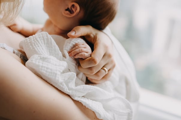 Woman holding new born