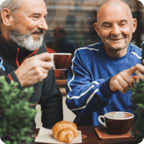 two men enjoying having a coffee