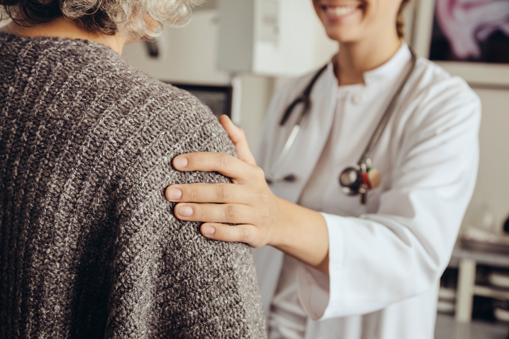 Doctor and patient smiling